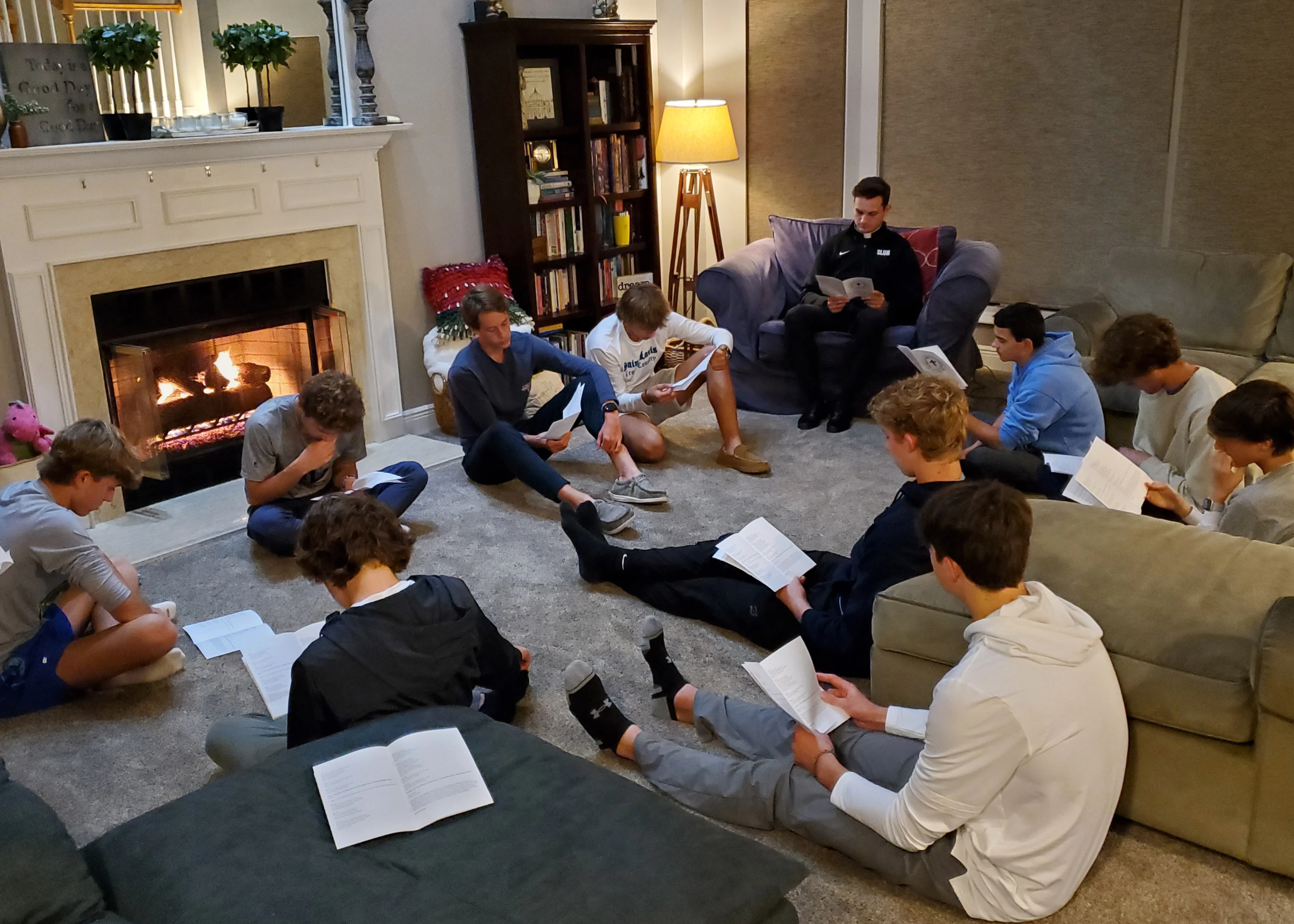 A group of SLU sodalists praying as a group